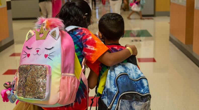 Students walk through the hallway on the first day of school at Clark Creek Elementary School in Acworth, Georgia, on August 2, 2021. (Rebecca Wright for the Atlanta Journal-Constitution)
