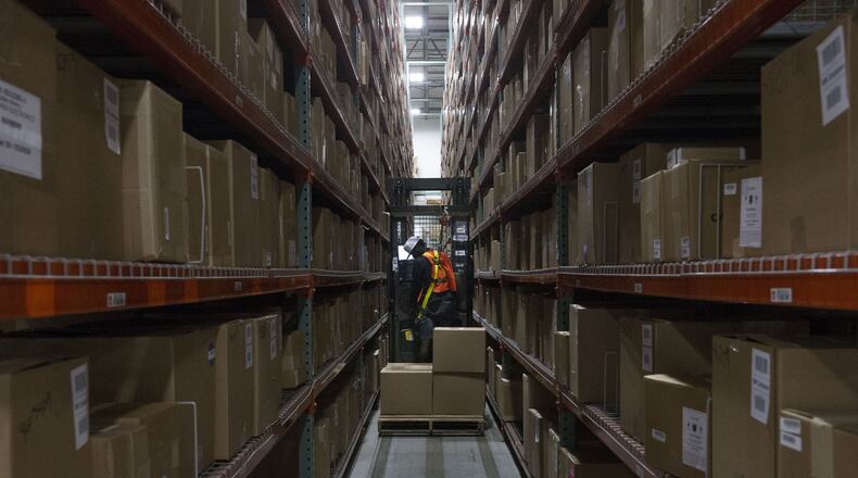 Forklift driver Gerry Giddings looks for an item at the Liquidity Services warehouse in Garland, Texas on Wednesday, November 7, 2018. Giddings is operating an order picker, capable of elevating the operator to the top of the product shelves. (Daniel Carde/Dallas Morning News/TNS)