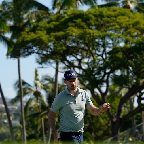 Nick Taylor, of Canada, reacts on the 18tyh hole during the first round of the Sony Open golf event at the Waialae Country Club in Honolulu, Thursday, Jan. 15, 2026. (AP Photo/Matt York)