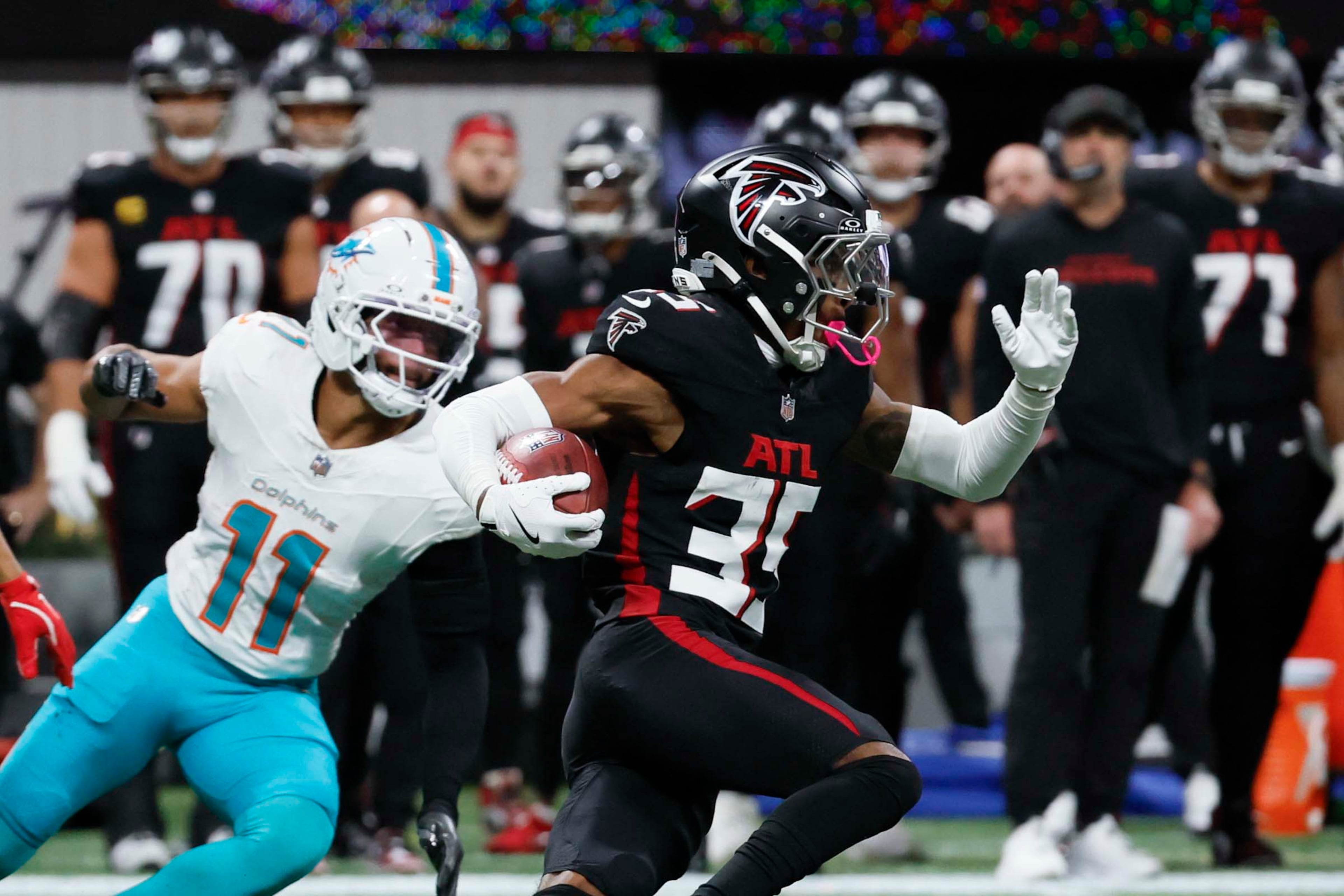 Atlanta Falcons cornerback Natrone Brooks rushes with the ball during the first half of an NFL game against the Miami Dolphins at Mercedes-Benz Stadium in Atlanta on Sunday, Oct. 26, 2025.  (Miguel Martinez/AJC)