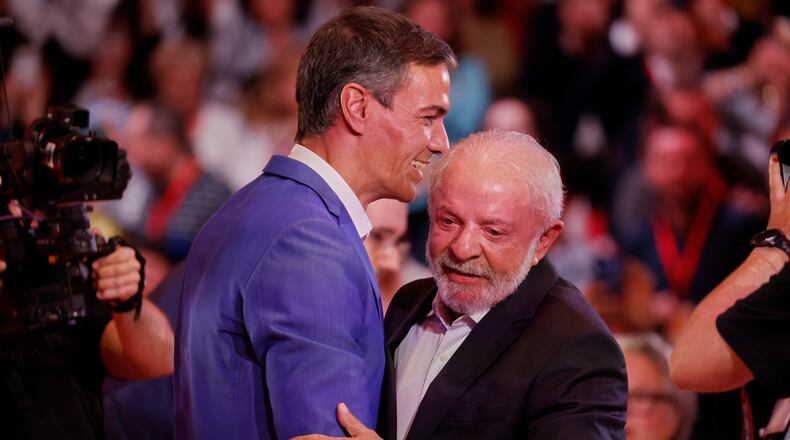 Spain's Prime Minister Pedro Sanchez, left, embraces Brazil's President Luiz Inacio Lula da Silva at the end of the Global Progressive Mobilisation summit in Barcelona, Spain, Saturday, April 18, 2026. (AP Photo/Joan Monfort)