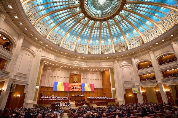 Romania’s newly elected president Nicusor Dan takes the oath as he is sworn in, at the parliament in Bucharest, Romania, Monday, May 26, 2025. (AP Photo/Vadim Ghirda)