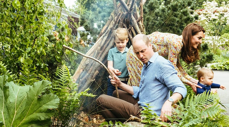 In this image made available on Sunday May 19, 2019 by Kensington Palace, Britain's Prince William, Kate, Duchess of Cambridge and their children, Prince George, Princess Charlotte and Prince Louis play in a garden co-designed by Kate Middleton, Adam White and Andree Davies ahead of the RHS Chelsea Flower Show in London.