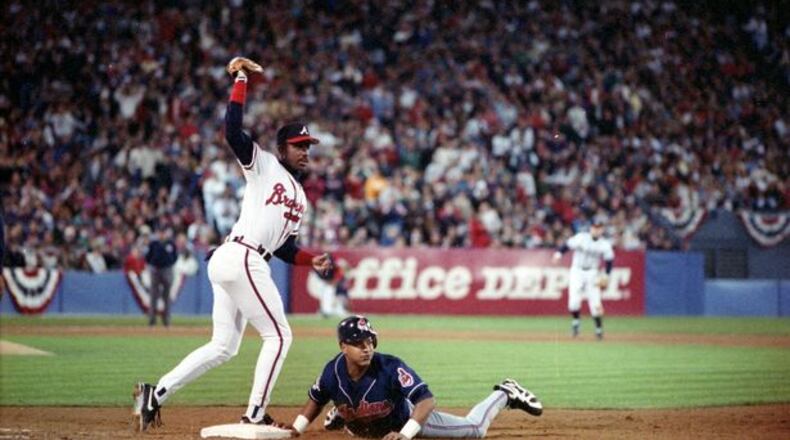 Game 2, 1995 World Series: Fred McGriff tags out Manny Ramirez. (David Tulis/AJC)
