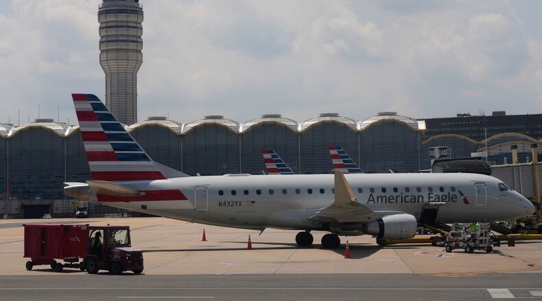 FILE - An American Eagle plane is parked at a gate at the Ronald Reagan Washington National Airport in Arlington, Va., June 29, 2026. (AP Photo/Carolyn Kaster, File)