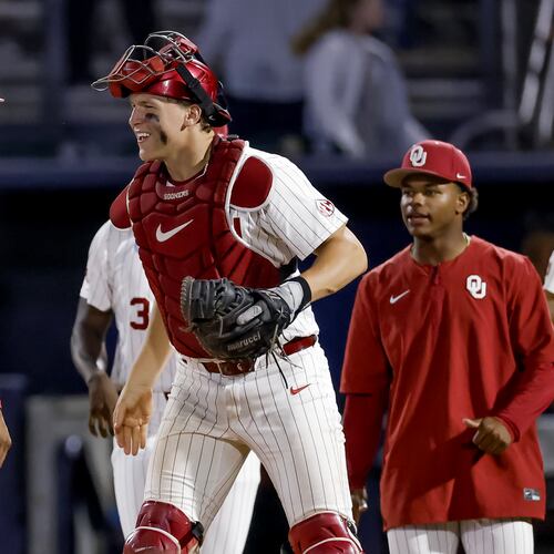 Oklahoma pitcher Lj Mercurius, left, celebrates with catcher Deiten Lachance, center, after defeating Georgia Tech in the ninth inning of the NCAA D1 Atlanta Regional elimination baseball game at Russ Chandler Stadium, Sunday, May 31, 2026, in Atlanta. The Yellow Jackets lost to the Sooners and will have to play on Monday, June 1. (Erik S. Lesser for the AJC)