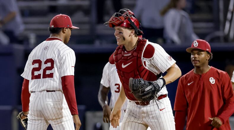 Oklahoma pitcher Lj Mercurius, left, celebrates with catcher Deiten Lachance, center, after defeating Georgia Tech in the ninth inning of the NCAA D1 Atlanta Regional elimination baseball game at Russ Chandler Stadium, Sunday, May 31, 2026, in Atlanta. The Yellow Jackets lost to the Sooners and will have to play on Monday, June 1. (Erik S. Lesser for the AJC)