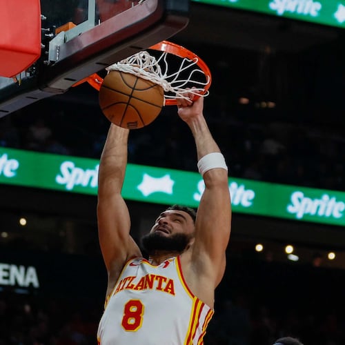 David Roddy, here dunking against the Celtics in November, played 27 games for the Hawks last season before being waived to make roster room following a slew of deals just before the trade deadline. (Miguel Martinez/AJC)