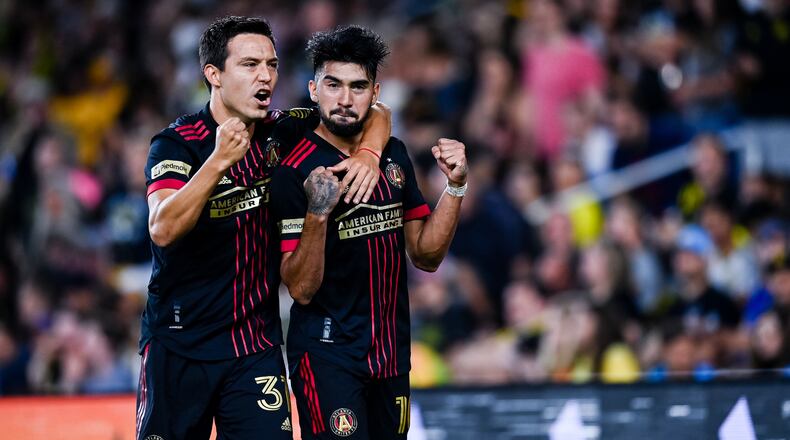 Atlanta United midfielder Marcelino Moreno (10) celebrates with forward Erick Torres (31) during the match against Columbus Crew Saturday, Aug. 7, 2021, at Lower.com Field in Columbus, Ohio. (Jacob Gonzalez/Atlanta United)