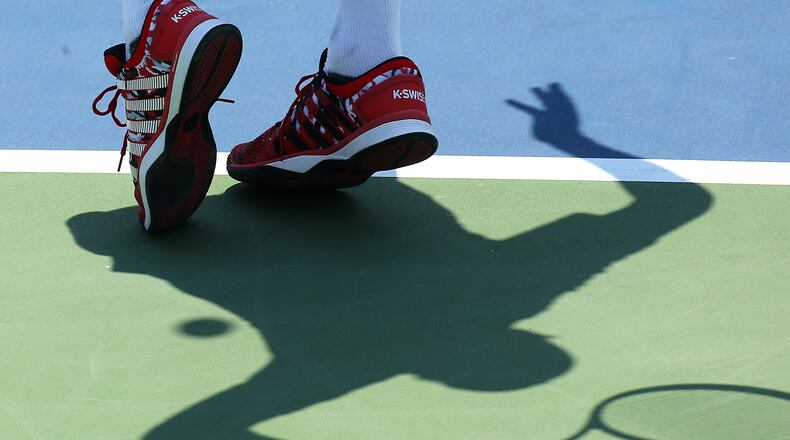 Bob Bryan, USA, casts a shadow on the court as he serves to Colin Fleming (GBR) and Gilles Muller (LUX) in their doubles final match during the Atlanta Open in this 2015 file photo.