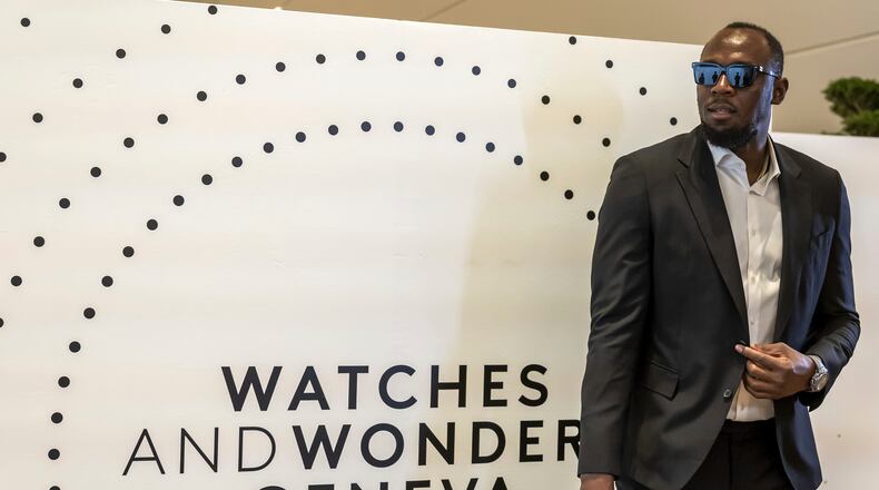 FILE - Former Jamaican sprinter Usain Bolt arrives for a photo call into Hublot stand, during the "Watches and Wonders Geneva" luxury watch fair, in Geneva, Switzerland, April 2, 2025. (Salvatore Di Nolfi/Keystone via AP, file)