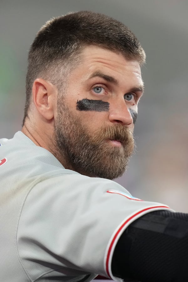 Philadelphia Phillies first baseman Bryce Harper (3) looks out from the dugout during a baseball game against the Toronto Blue Jays in Toronto, Thursday, June 5, 2025. (Chris Young/The Canadian Press via AP)