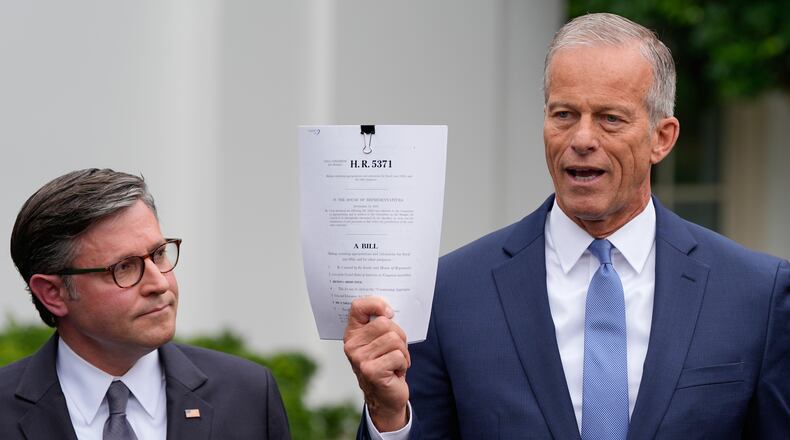 Senate Majority Leader John Thune, R-S.D., spoke to reporters outside of the White House on Monday as House Speaker Mike Johnson listened. (Alex Brandon/AP)