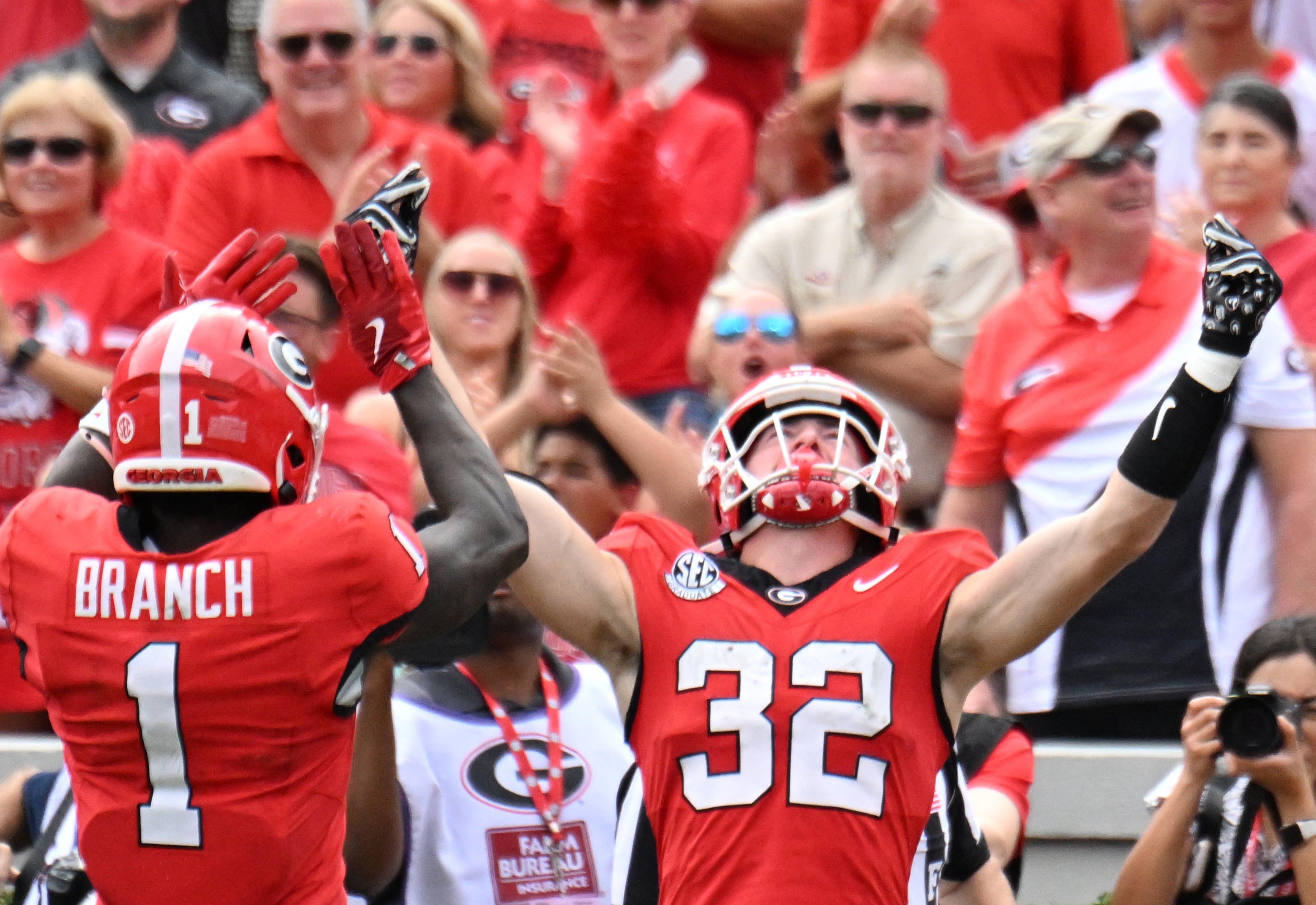 Georgia running back Cash Jones (32) celebrates after scoring a touchdown during the second half in a NCAA college football game at Sanford Stadium, Saturday, October 4, 2025, in Athens. Georgia won 35 -14 over Kentucky. (Hyosub Shin / AJC)