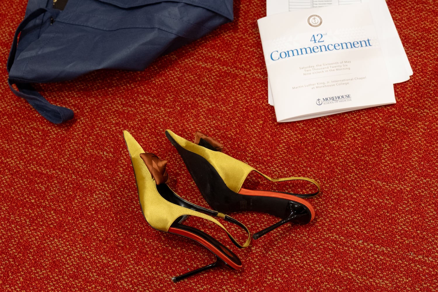 A pair of high heels lie in the hallway outside of the Martin Luther King International Chapel at Morehouse College during the Morehouse School of Medicine graduation ceremony on Saturday, May 16, 2026, in Atlanta. (Ben Gray for the AJC)
