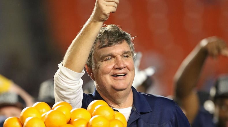 MIAMI GARDENS, FL - DECEMBER 31: Head coach Paul Johnson of the Georgia Tech Yellow Jackets waves to the crowd after the Capital One Orange Bowl game against the Mississippi State Bulldogs at Sun Life Stadium on December 31, 2014 in Miami Gardens, Florida. (Photo by Marc Serota/Getty Images) Georgia Tech coach Paul Johnson led the Yellow Jackets to their first major bowl title since the 1956 Sugar Bowl. (ASSOCIATED PRESS)