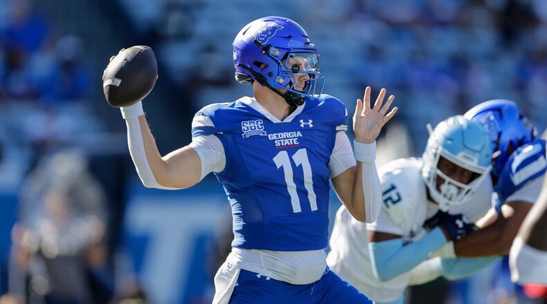 Georgia State's Christian Veilleux (11) throws the ball during the first half of an NCAA football game against Old Dominion on Saturday, Oct.12 , 2024 in Atlanta. (AP Photo/Stew Milne)