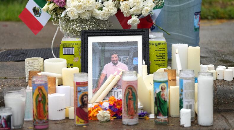 A memorial grows at the site where Lorenzo Salgado Araujo was fatally shot by ICE agents, last week, on Monday, July 13, 2026, in Houston. (AP Photo/Karen Warren)