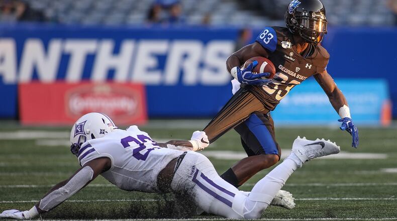 Furman linebacker Elijah McKoy (23) holds on to the shirt of Georgia State wide receiver Cornelius McCoy (83) at Georgia State Stadium, Saturday, Sept. 7, 2019, in Atlanta. BRANDEN CAMP/SPECIAL