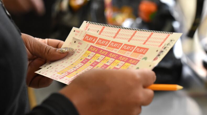 A customer chooses which numbers to play in Georgia's Powerball game.