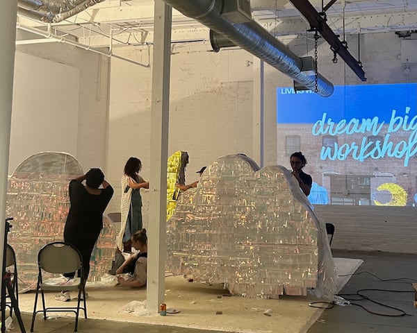 Living Walls artists construct massive piñatas for the nonprofit organization's upcoming quinceañero fiesta. The piñatas will be auctioned off as a fundraiser at the event. (Courtesy of Tatiana Bell)