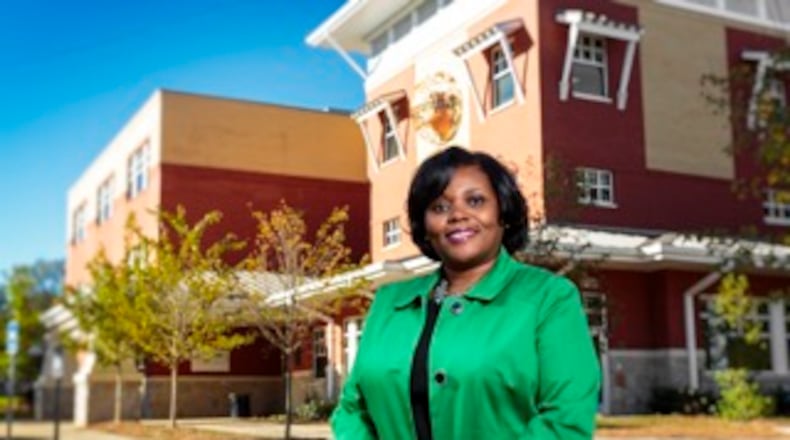 Principal Karen Newton stands in front of Decatur’s 4/5 Academy. Should the school system restructure to eliminate the need for a school like that. CONTRIBUTED