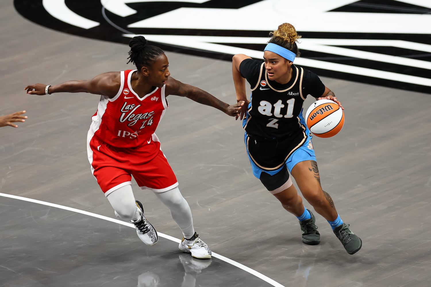 Atlanta Dream guard Te-Hina Paopao (2) dribbles against Las Vegas Aces guard Jewell Loyd (24) during the second half of a WNBA game at State Farm Arena on Sunday, May 17, 2026, in Atlanta. (Colin Hubbard for the AJC) 
