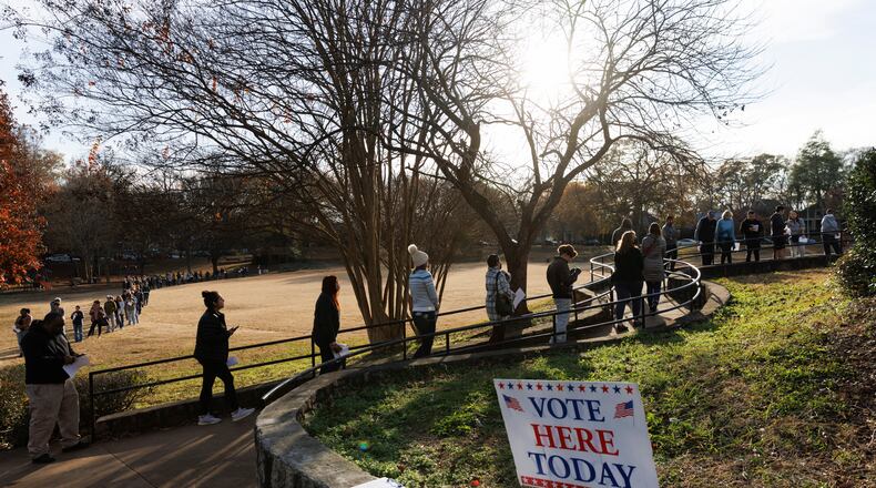 FILE — Voters wait to cast their ballots outside a polling location at the Bessie Branham Recreation Center in Atlanta on Friday, Dec. 2, 2022. Republicans in Georgia violated a landmark civil rights law in drawing voting maps that diluted the power of Black voters, a federal judge in Atlanta ruled on Thursday, Oct. 26, 2023, ordering that new maps must be drawn in time for the 2024 elections. (Dustin Chambers/The New York Times).