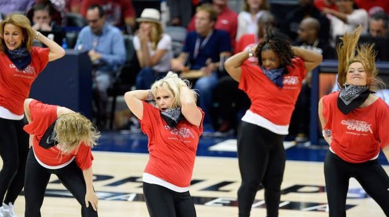 Members of the Silver Classix Crew, Connie Korb, Marci Nunnery (head down), Dinah Farrell, Wendy C. Waddell and Margaret Snider, put on a halftime show during an Atlanta Hawks game. The women are all over 50. DAVID TULIS / UPI