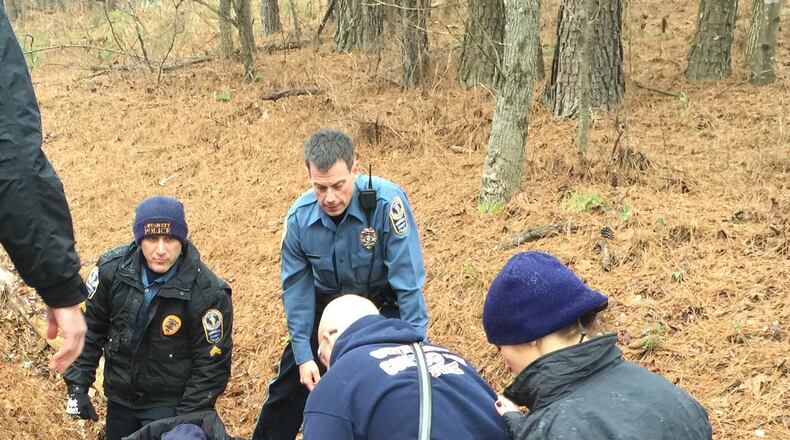 Police officers wrapped Keith Franklin in their jackets to keep him warm as they waited for emergency medical services to arrive. (Credit: Gwinnett County Police Department)
