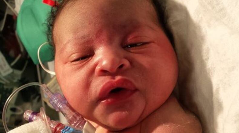 This newborn was found abandoned Monday night outside a home on Harlan Road in southwest Atlanta. (Credit: Channel 2 Action News)