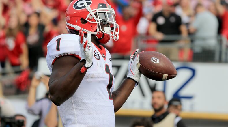 PASADENA, CA - JANUARY 01:  Running back Sony Michel #1 of the Georgia Bulldogs celebrates after he scores a touchdown on a 13-yard reception in the first quarter against the Oklahoma Sooners in the 2018 College Football Playoff Semifinal at the Rose Bowl Game presented by Northwestern Mutual at the Rose Bowl on January 1, 2018 in Pasadena, California.  (Photo by Sean M. Haffey/Getty Images)