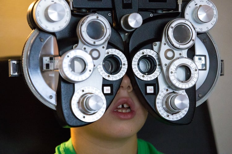 Children need a thorough eye exam starting before kindergarten and every year after as part of their back-to-school examinations, an Atlanta optometrist says. (Casey Sykes for the AJC)