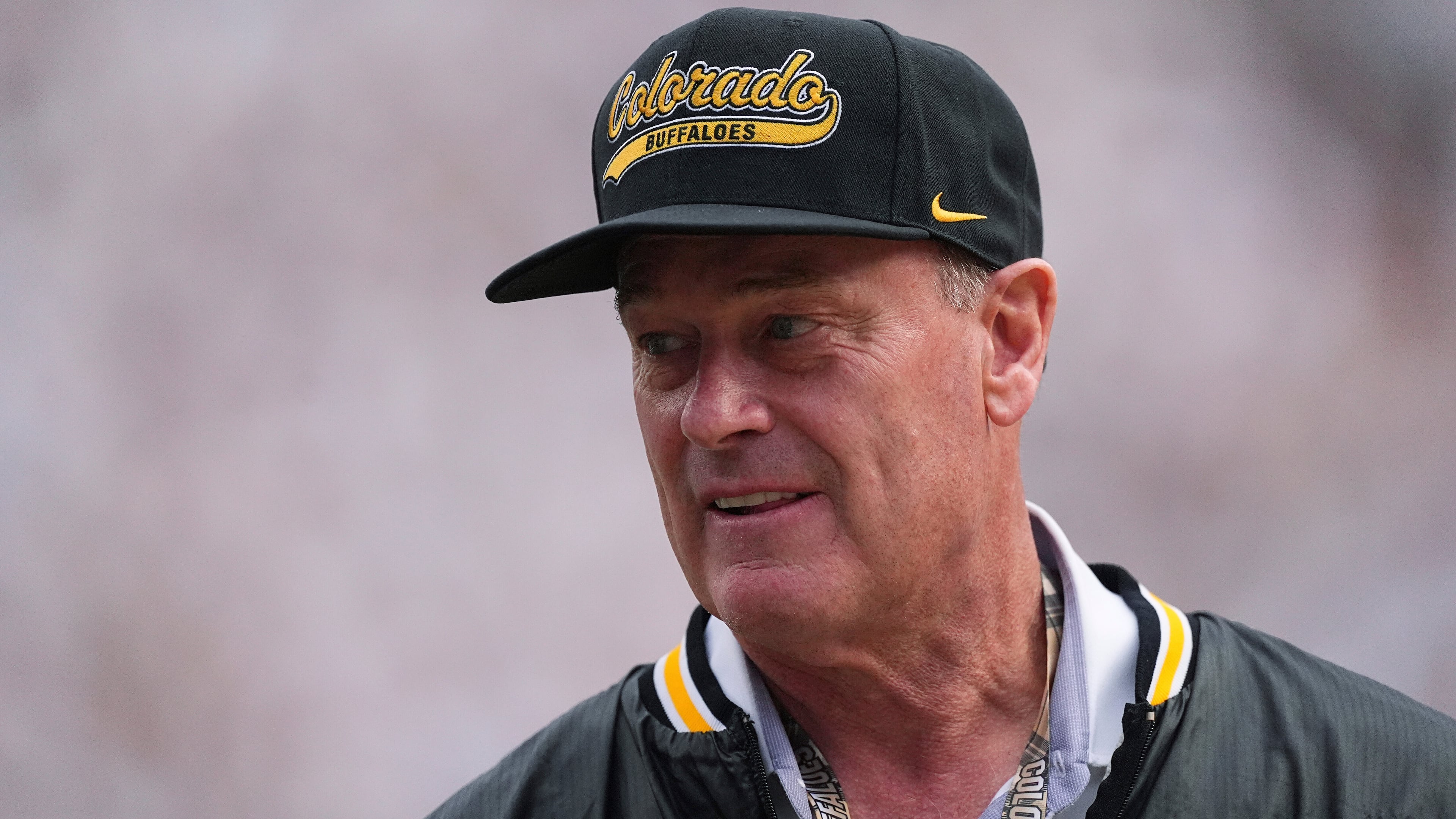 FILE - Colorado athletic director Rick George watches as players warm up before an NCAA college football game Aug. 29, 2025, in Boulder, Colo. (AP Photo/David Zalubowski, File)