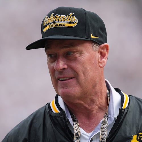 FILE - Colorado athletic director Rick George watches as players warm up before an NCAA college football game Aug. 29, 2025, in Boulder, Colo. (AP Photo/David Zalubowski, File)