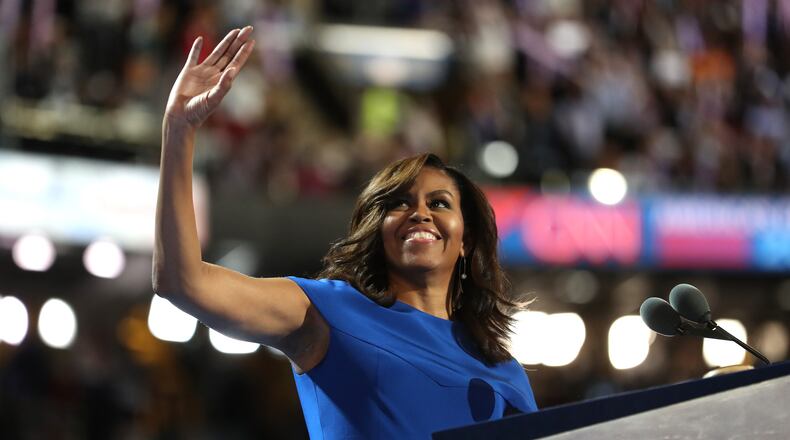 PHILADELPHIA, PA - JULY 25: First lady Michelle Obama acknowledges the crowd after delivering remarks on the first day of the Democratic National Convention at the Wells Fargo Center, July 25, 2016 in Philadelphia, Pennsylvania. An estimated 50,000 people are expected in Philadelphia, including hundreds of protesters and members of the media. The four-day Democratic National Convention kicked off July 25. (Photo by Joe Raedle/Getty Images)