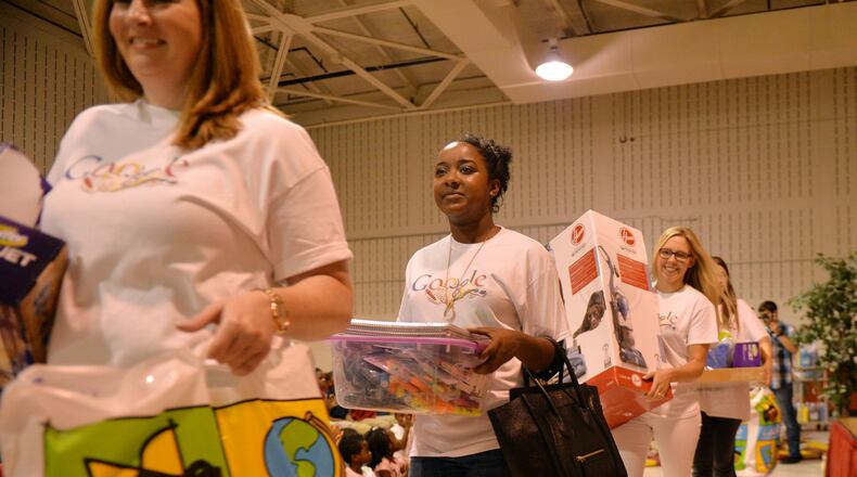 Google Atlanta employees bring out the supplies. Atlanta Mayor Kasim Reed surprised teachers and students at Whitefoord Elementary School by announcing a surprise gift of $25,000 in school supplies by Google Atlanta. Every project requested by teachers at the school was funded.