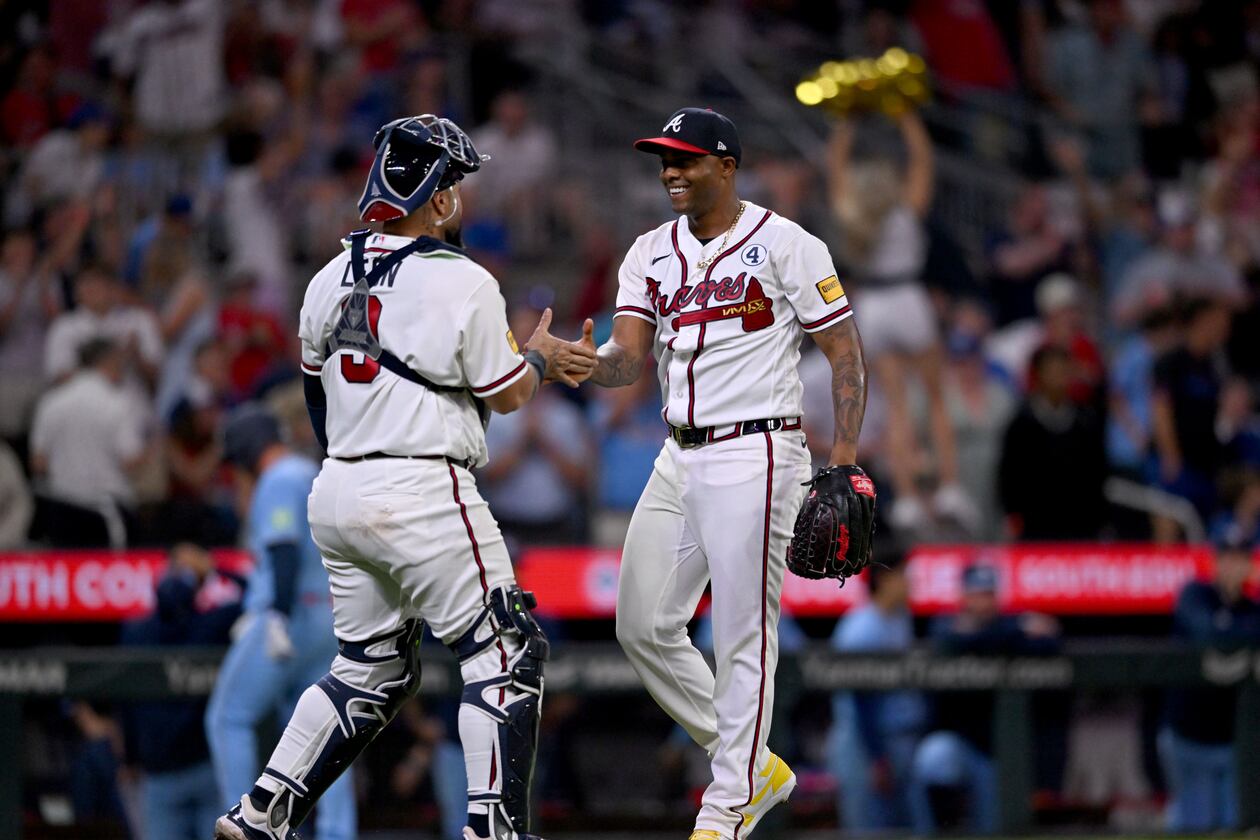 Braves pitcher Raisel Iglesias (right) celebrates with catcher Sandy León after a win against the Blue Jays at Truist Park on Tuesday, June 2, 2026, in Atlanta. (Hyosub Shin/AJC)