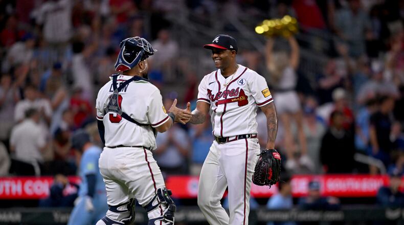 Braves pitcher Raisel Iglesias (right) celebrates with catcher Sandy León after a win against the Blue Jays at Truist Park on Tuesday, June 2, 2026, in Atlanta. (Hyosub Shin/AJC)