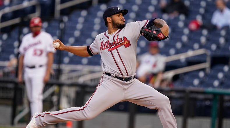 Atlanta Braves starting pitcher Huascar Ynoa throws during the first inning of baseball game against the Washington Nationals at Nationals Park, Tuesday, May 4, 2021, in Washington. (AP Photo/Alex Brandon)