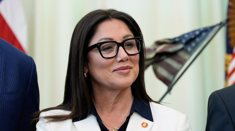 FILE - Labor Secretary Lori Chavez-DeRemer listens as President Donald Trump speaks in the Oval Office of the White House, Oct. 16, 2025, in Washington. (AP Photo/Alex Brandon, File)