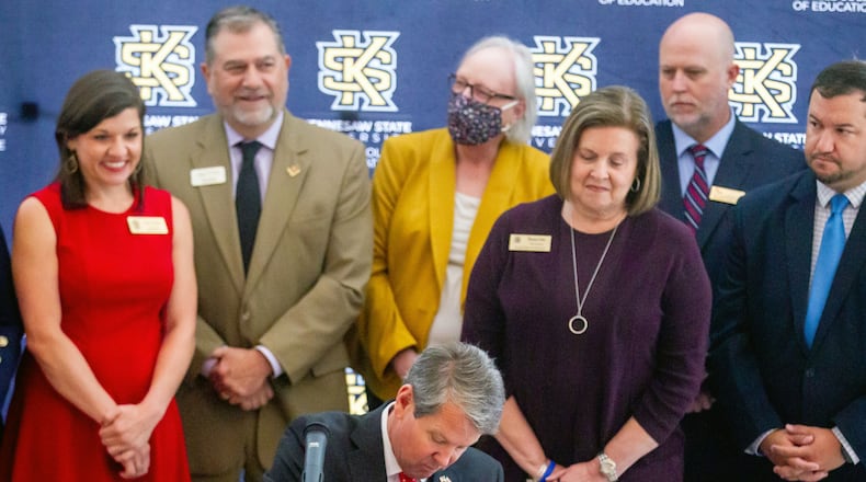 Gov. Brian Kemp signs a half dozen education bills surrounded by government officials and advocates at Kennesaw State University Tuesday, May 4, 2021. STEVE SCHAEFER FOR THE ATLANTA JOURNAL-CONSTITUTION