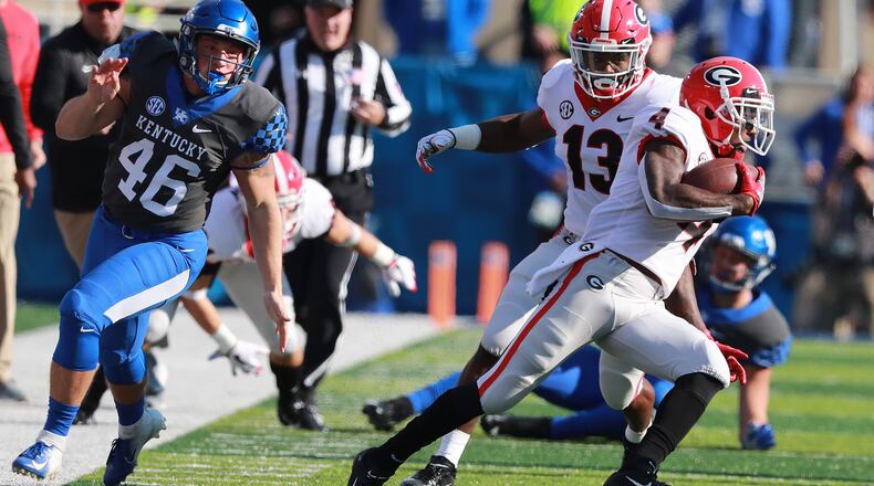 Georgia wide receiver Mecole Hardam makes a long punt return setting up a touchdown drive against Kentucky during the first quarter in a NCAA college football game on Saturday, Nov. 3, 2018, in Lexington. Curtis Compton/ccompton@ajc.com