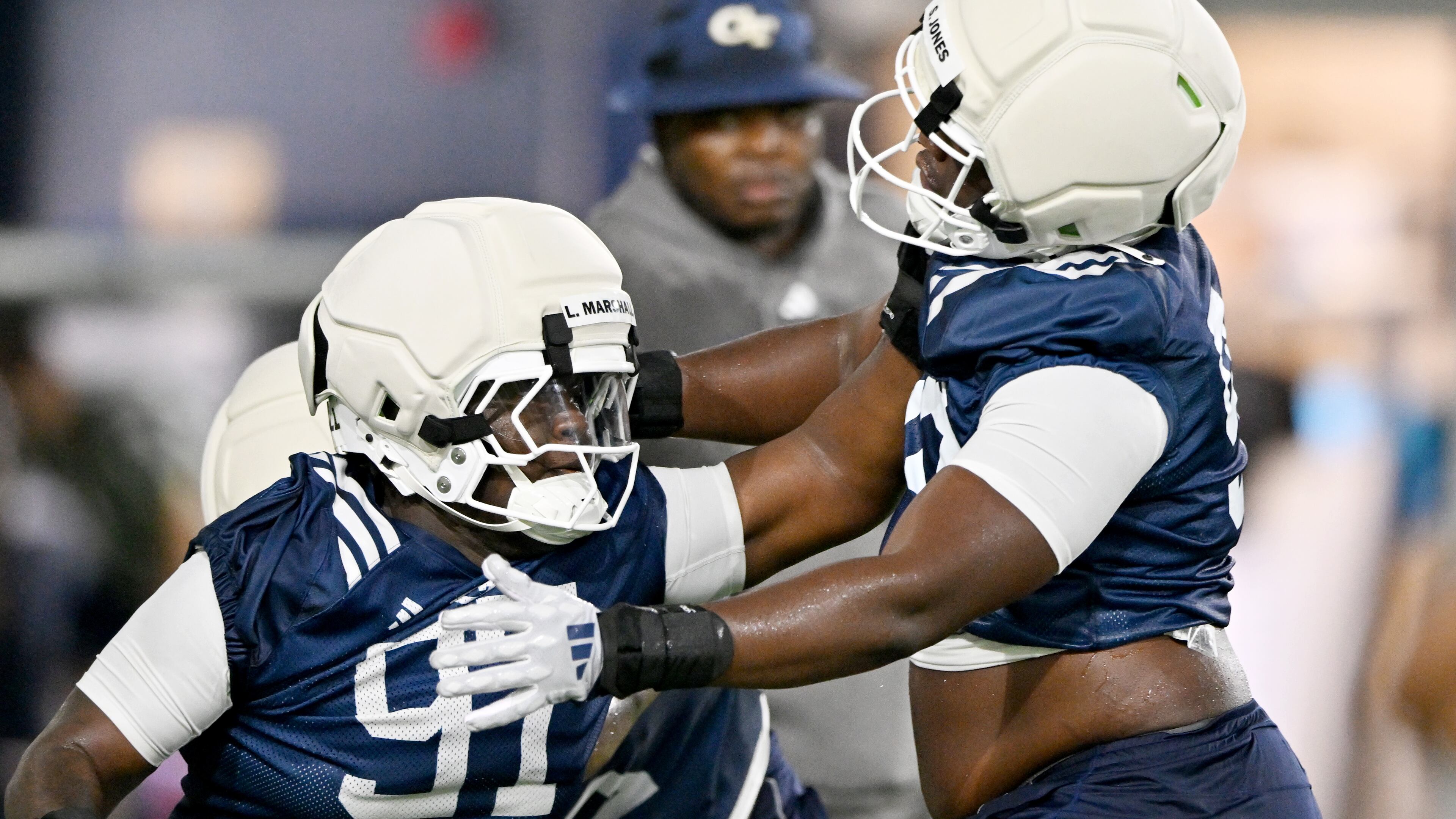 Georgia Tech defensive linemen Landen Marshall (left) and Shymeik Jones run a drill during the first day of practice at Rose Bowl Field and the Mary and John Brock Football Practice Facility, Tuesday, July 29, 2025, in Atlanta. (Hyosub Shin/AJC)