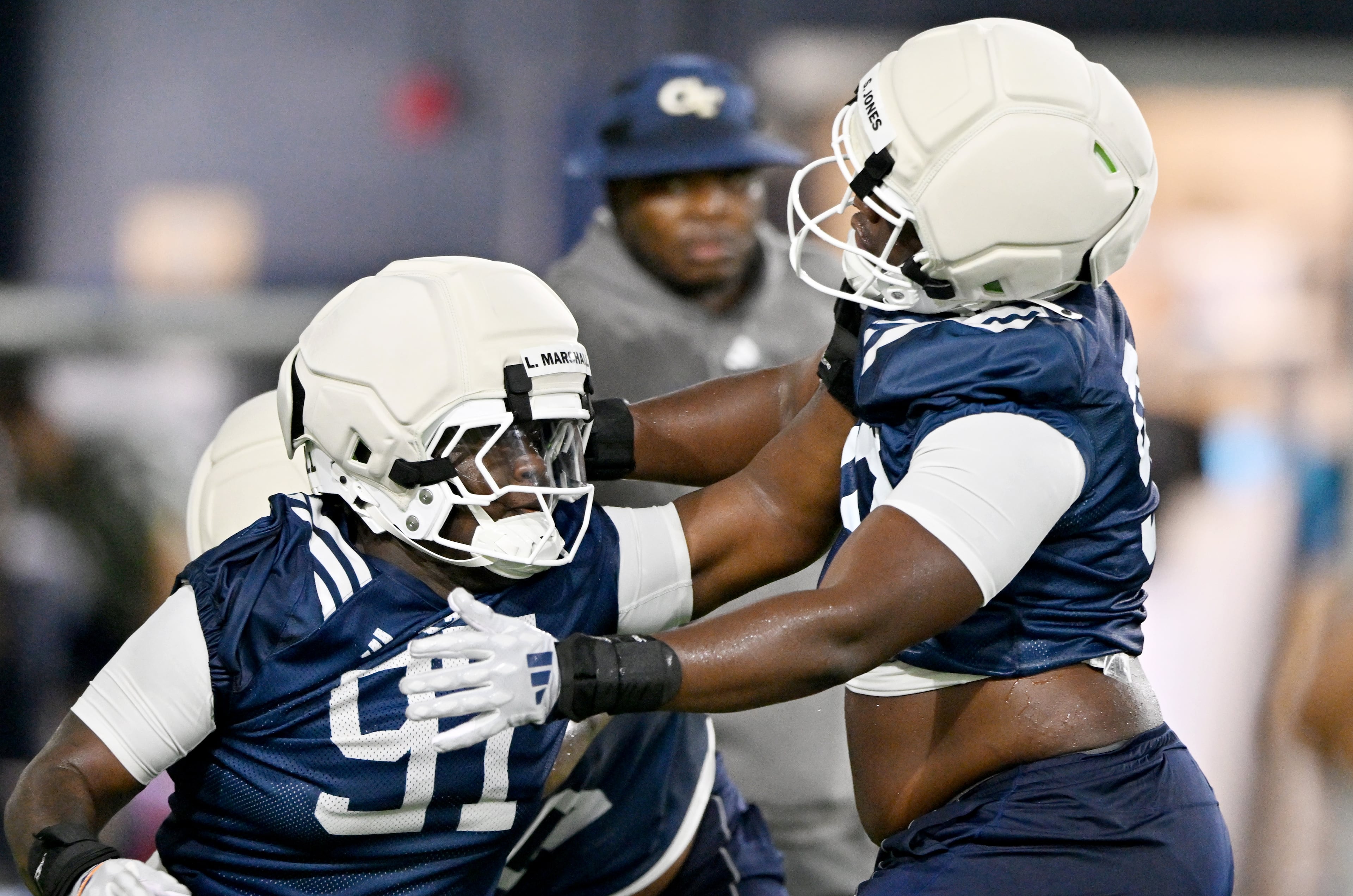 Georgia Tech defensive lineman Landen Marshall (left) and Georgia Tech defensive lineman Shymeik Jones run a drill during the first day of football practice at Rose Bowl Field and the Mary and John Brock Football Practice Facility, Tuesday, July 29, 2025, in Atlanta. (Hyosub Shin / AJC)