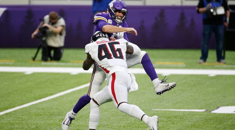 Atlanta Falcons linebacker Edmond Robinson (46) hits Minnesota Vikings quarterback Kirk Cousins (8) during the first half Sunday, Oct. 18, 2020, in Minneapolis. (Bruce Kluckhohn/AP)