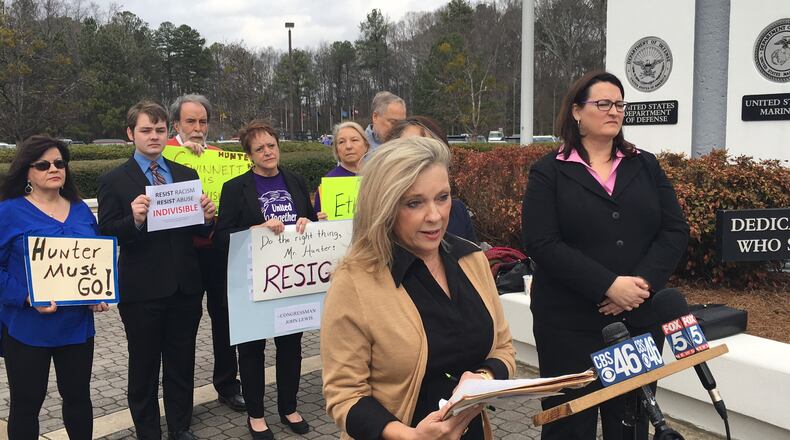 Atlanta resident Nancie Turner, center, speaks Tuesday outside the Gwinnett County Justice and Administration Center about the ethics complaint she filed against Gwinnett County Commissioner Tommy Hunter. TYLER ESTEP / TYLER.ESTEP@AJC.COM