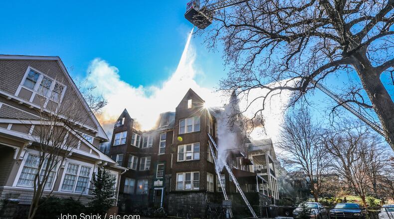 Atlanta firefighters battle a blaze at a three-story apartment building in Midtown.