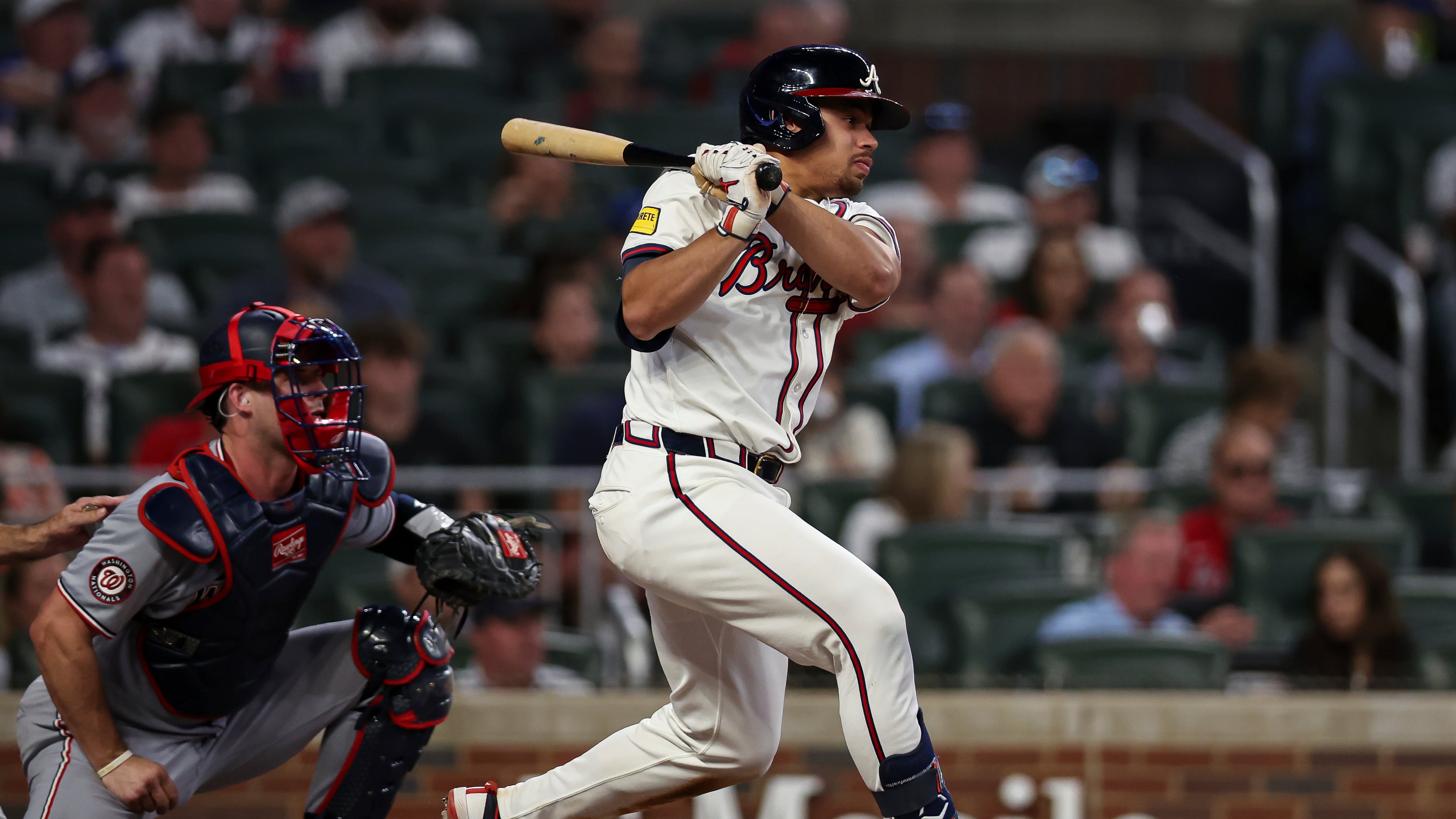 Atlanta Braves' Drake Baldwin, right, drives in two runs with a single in the third inning of a baseball game against the Washington Nationals, Monday, Sept. 22, 2025, in Atlanta. (AP Photo/Colin Hubbard)