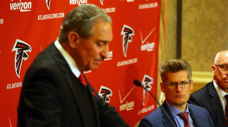 ***VISUAL LEDE****122914 ATLANTA: General Manager Thomas Dimitroff looks on while Falcons owner Arthur Blank takes questions at a press conference after the firing of head coach Mike Smith at the Arthur M. Blank Foundation on Monday, Dec. 29, 2014, in Atlanta. Curtis Compton / ccompton@ajc.com Arthur Blank denied to the AJC that general manager Thomas Dimitroff has been stripped of any power. (Curtis Compton, AJC)